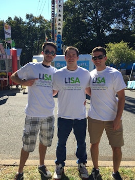 Volunteers At Town Fair  T-Shirt Photo